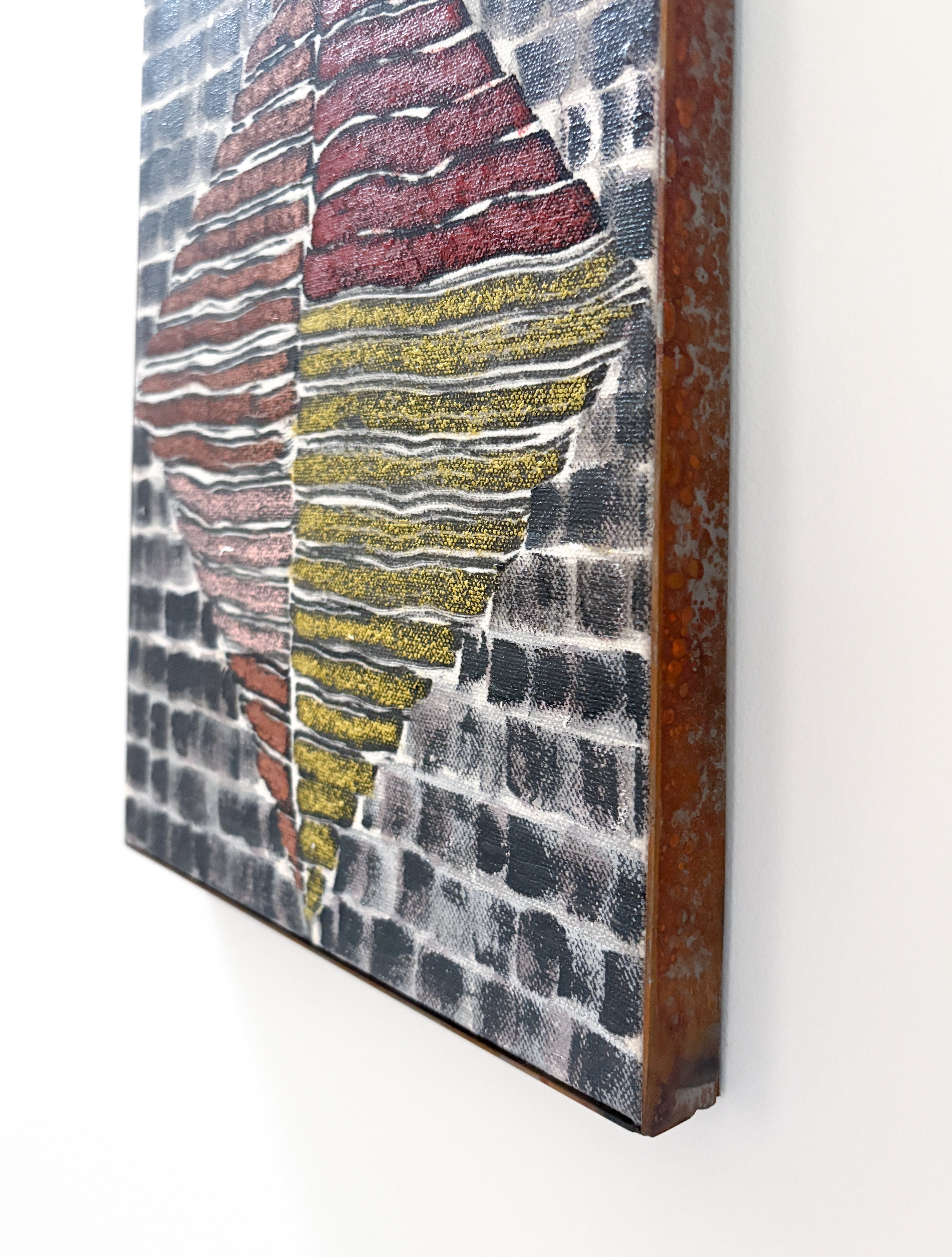 Abstract textured painting with wavy patterns in red, yellow, and gray on a white wall.